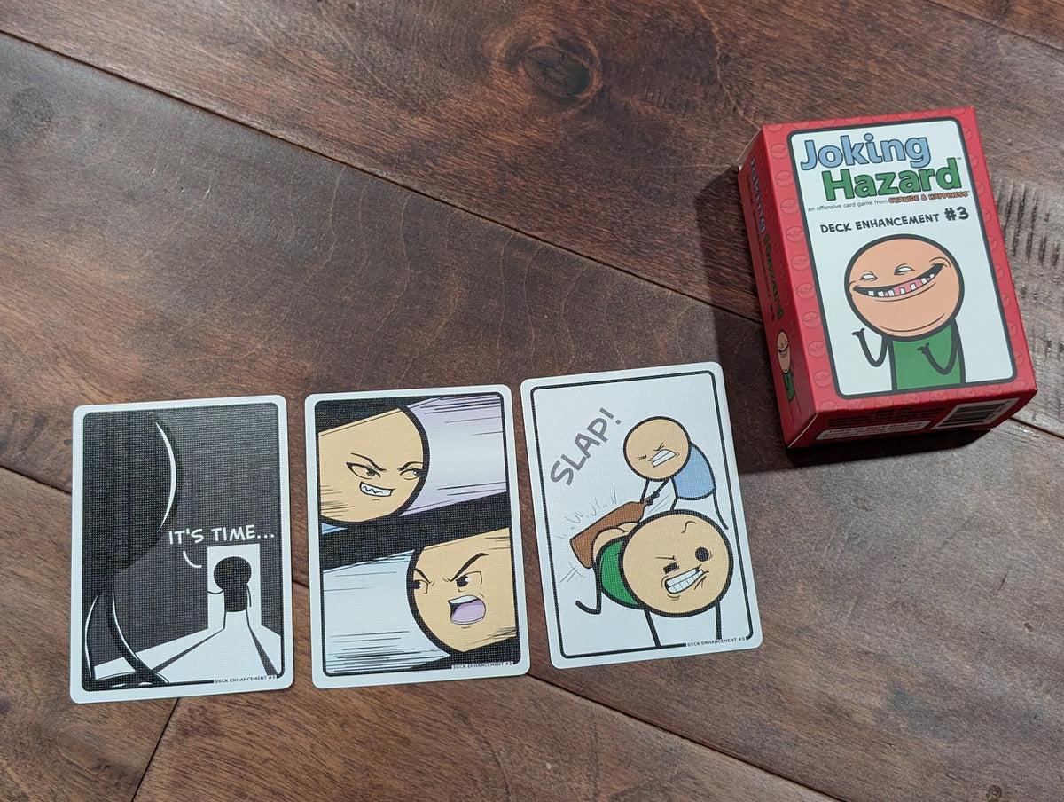Joking Hazard Deck Enhancement #3 box and cards on a wooden table